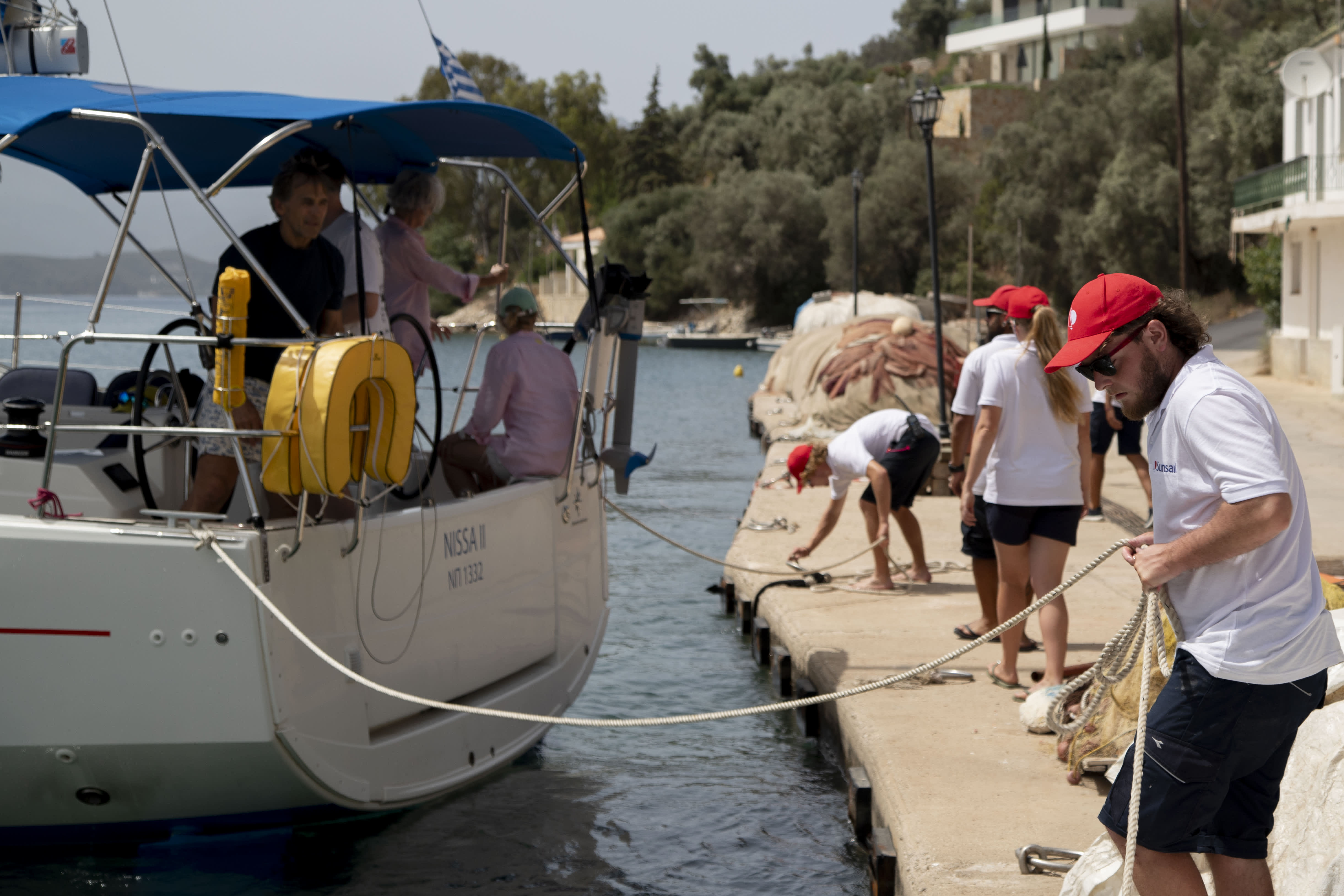 Sunsail lead crew helping a boat cast off