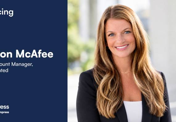 Announcement graphic from Europe Express introducing Shannon McAfee as Strategic Account Manager, Luxury | Elevated. The right side features a professional headshot of a smiling woman with long blonde hair wearing a black blazer. The left side displays a navy blue background with the text "Introducing Shannon McAfee, Strategic Account Manager, Luxury | Elevated" and the Europe Express logo with the tagline "Helping you impress."