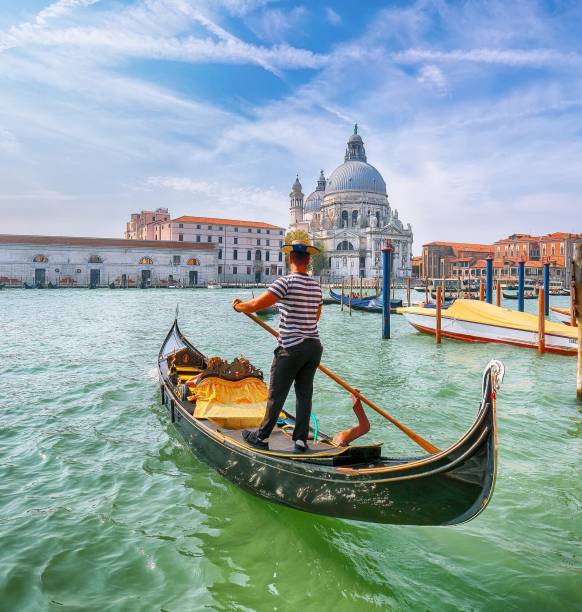 Breathtaking morning cityscape of Venice with famous Canal Grande and Basilica di Santa Maria della Salute church. Location: Venice, Veneto region, Italy, Europe