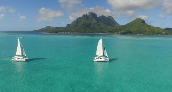 Two sailing catamarans in Tahiti