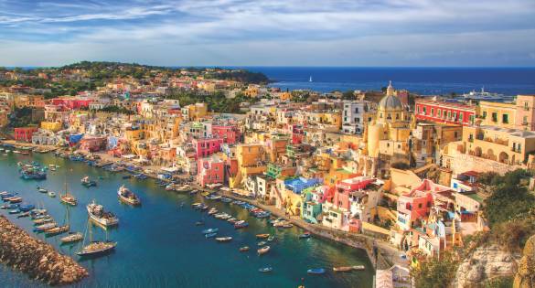 Colourful houses alongside the blue coast of Italy