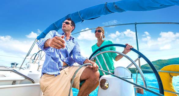 couple sailing the bvi on a monohull