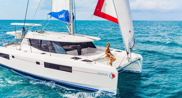 Guest sitting on Sunsail yacht while cruising