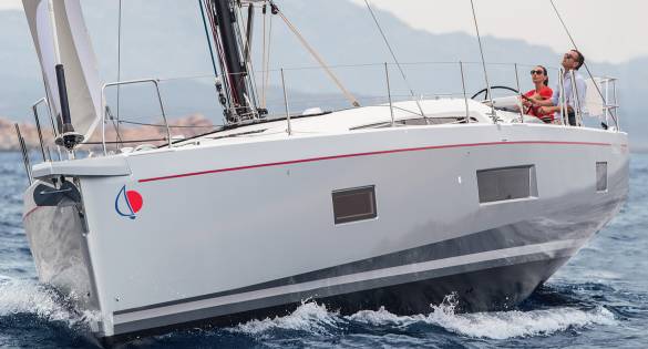 Man and woman sailing Sunsail 524