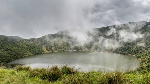 Enchanting Travels African safari parks to see - Lake inside Bisoke volcano crater, Virunga volcano national park, Rwanda