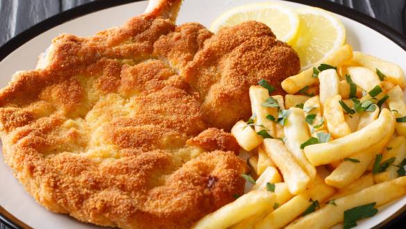 Veal alla Milanese in breadcrumbs with lemon and French fries