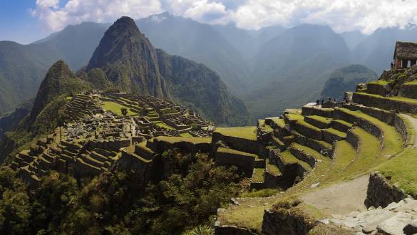 Peru Holidays - Panorama of Machu Picchu, Guard house, agriculture terraces, Wayna Picchu and surrounding mountains in the background - Peru Holidays