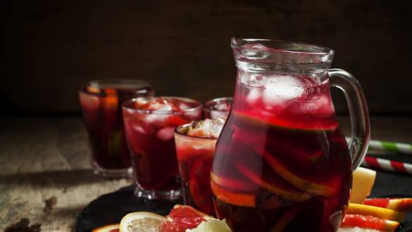 Sangria - This flavorsome punch is served cold and is essentially a mix of red wine, chopped fruit, and brandy. - Spanish cuisine