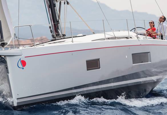 Man and woman sailing Sunsail 524