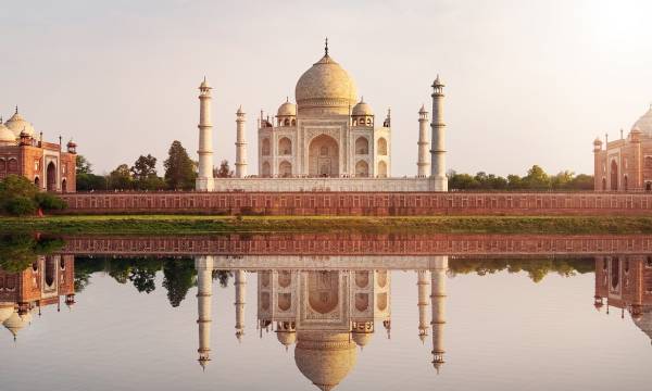 Sun set at Taj Mahal seen from Mehtab Bagh reflect on Yamuna river, an ivory-white marble mausoleum on the south bank of the Yamuna river in Agra, Uttar Pradesh, Enchanting Travels India tours