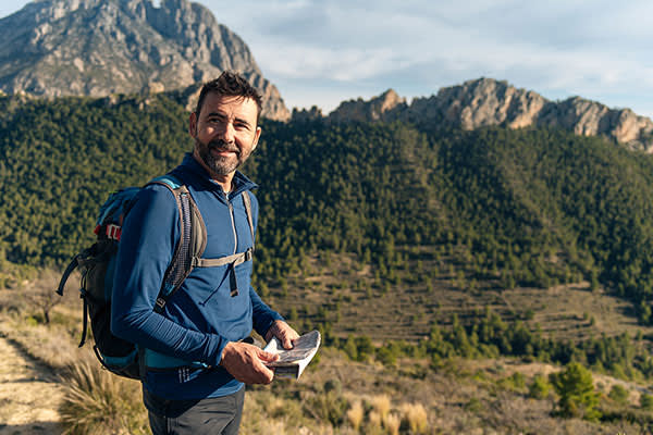 Solo traveller holding a map