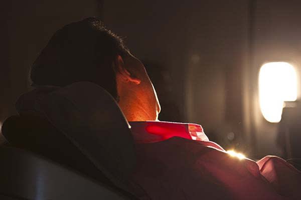 Man Sleeping on Airplane