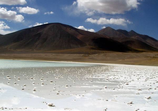 a beach with Laguna Verde in the background