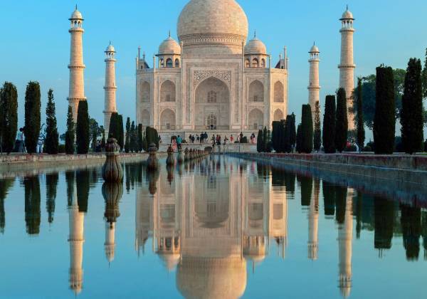 Taj Mahal with a pond in front of a lake