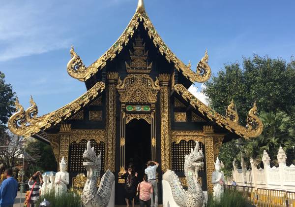 a group of people standing in front of a building