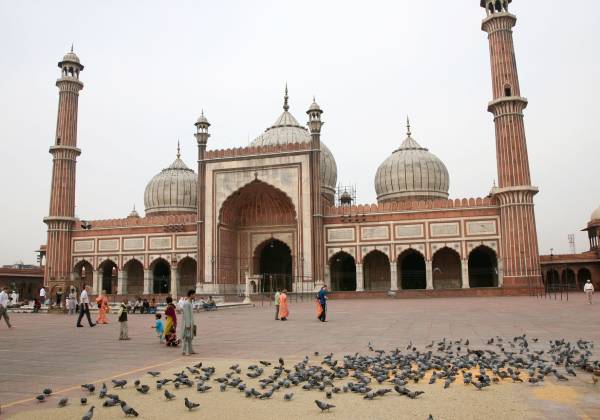 a group of people standing in front of Jama Masjid, Delhi