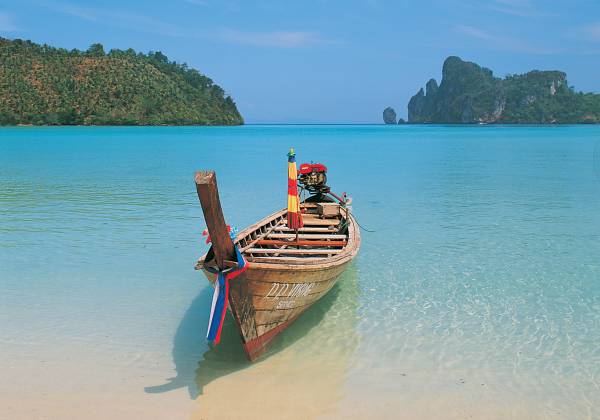 a person sitting in a boat on a body of water