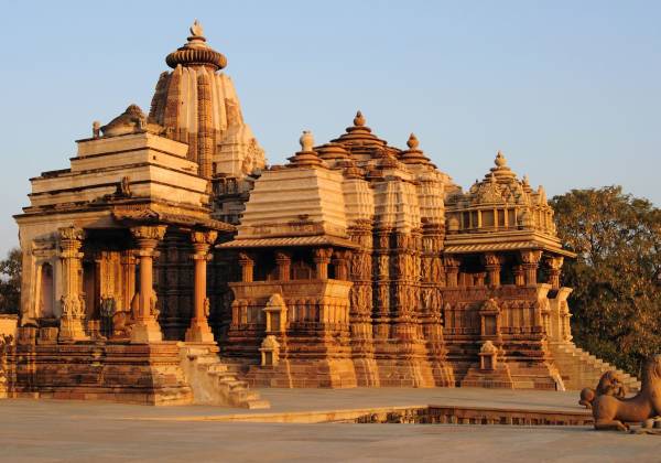 a group of people in front of Khajuraho Group of Monuments