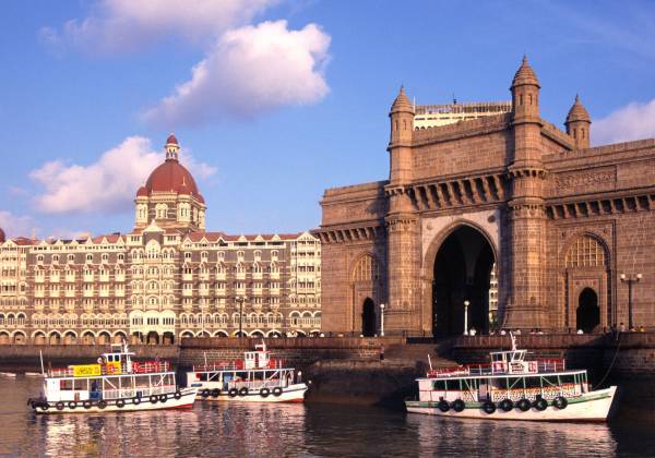 a boat on the water in front of a building