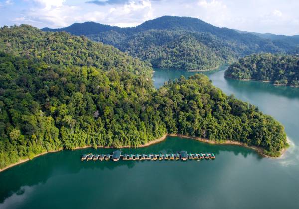 a body of water with a mountain in the background