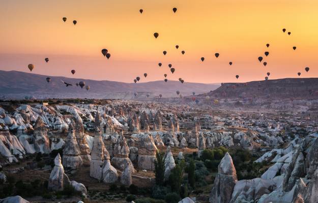 hot air balloons, rock formations, sunset