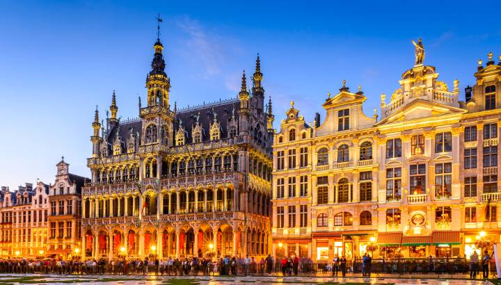 Brussels, Belgium. Wide angle night scene of the Grand Place and Maison du Roi, one of Europe finest historic squares and a must-see sight of Bruxelles.