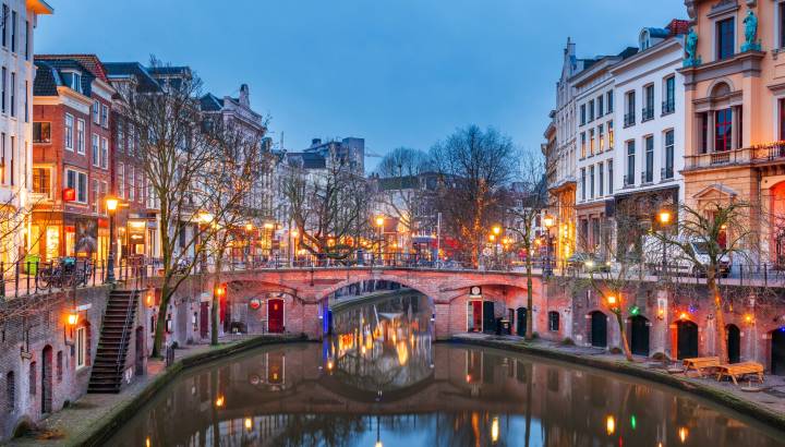 Utrecht, Netherlands canals and cityscape at twilight.