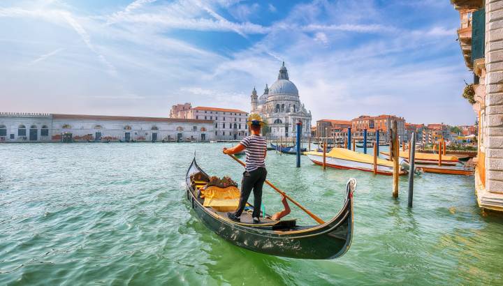 Breathtaking morning cityscape of Venice with famous Canal Grande and Basilica di Santa Maria della Salute church. Location: Venice, Veneto region, Italy, Europe