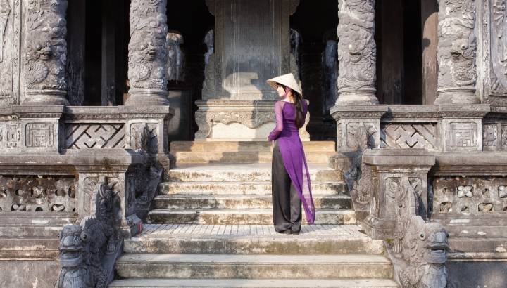 Vietnamese girl in long purple dress