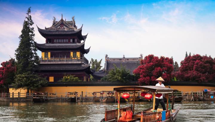 China traditional tourist boats at Shanghai Zhujiajiao town with boat and historic buildings, Shanghai China