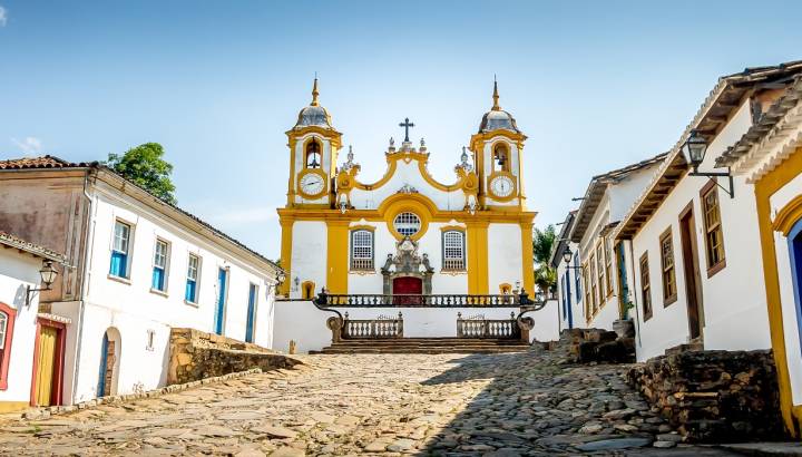 Colorful colonial houses and church in city of Tiradentes