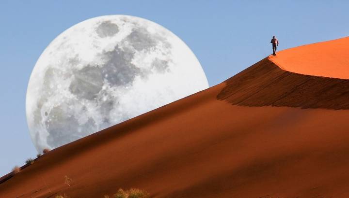 Dune walking in the Namib Desert at Sossusvlei in Namibia