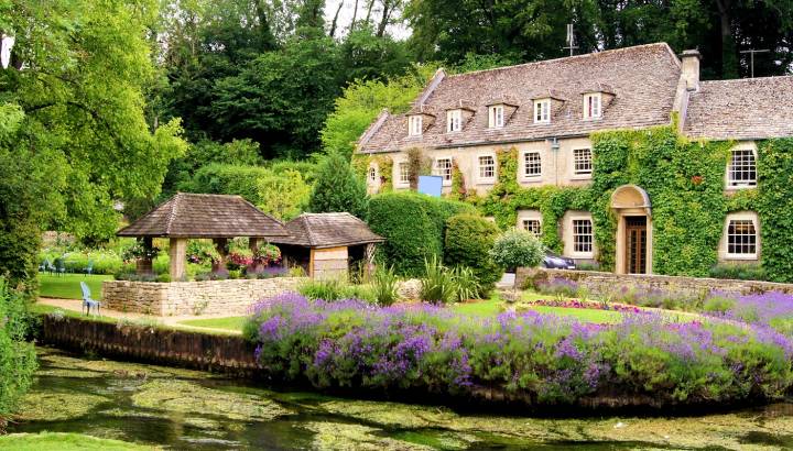 Enchanting Travels - Europe Tours - Picturesque garden in the Cotswold village of Bibury, England