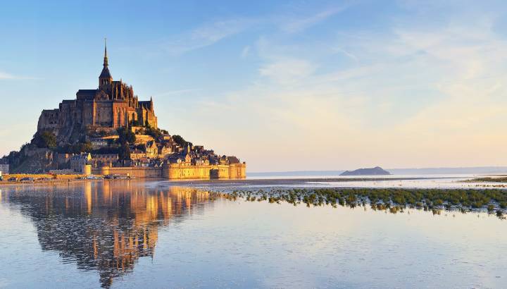 Beautiful panoramic view of famous Le Mont Saint-Michel tidal island, Normandy, northern France, Europe