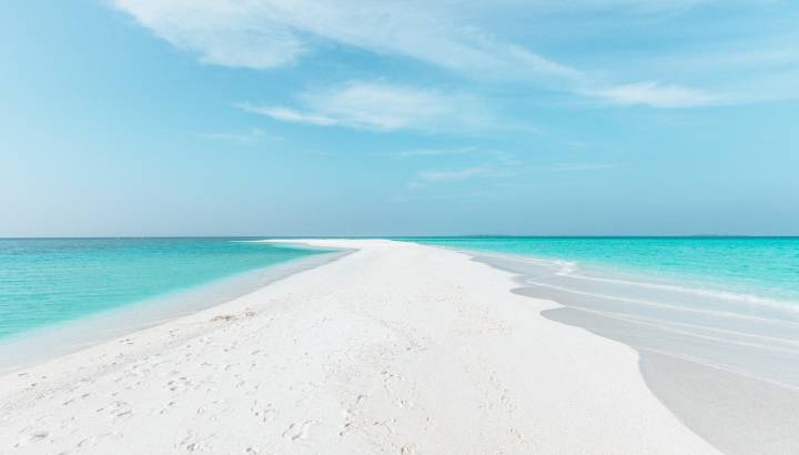 Sandbank in Maldives with crystal clear beautiful water and white sand