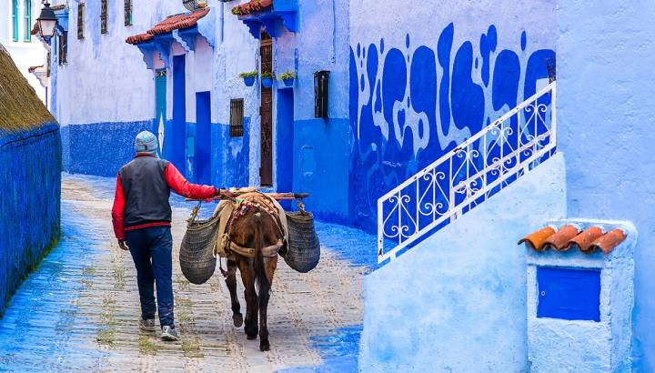 Things to do in Morocco Enchanting Travels Morocco Tours Street life in the blue city of Chefchaouen.