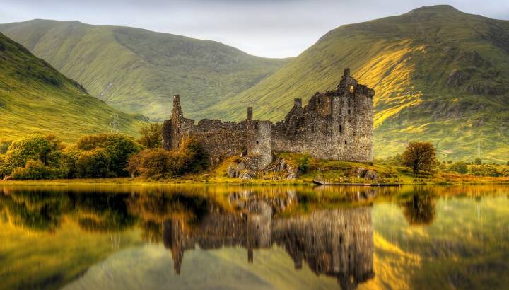 Enchanting Travels UK & Ireland Tours Kilchurn Castle reflections in Loch Awe at sunset, Scotland