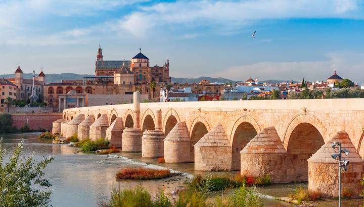 Great Mosque Mezquita - Catedral de Cordoba and Roman bridge across Guadalquivir river in the morning, Cordoba, Andalusia, Spain