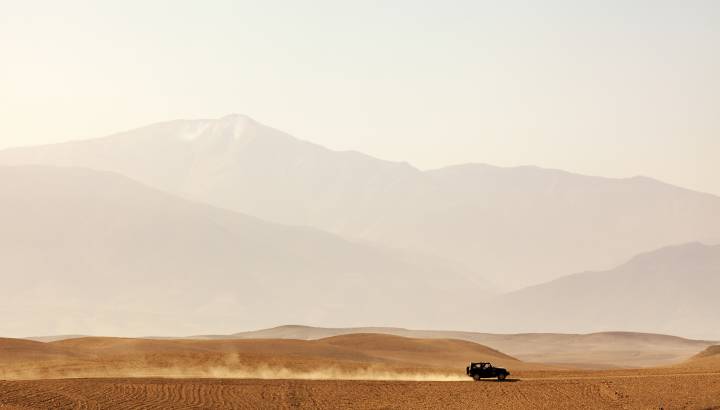 Vehicle driving through Agafay desert, Morocco