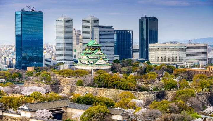 Osaka, Japan city skyline at the castle and business park in the spring.