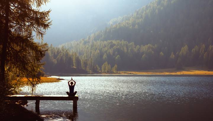 meditation and yoga practicing at sunset