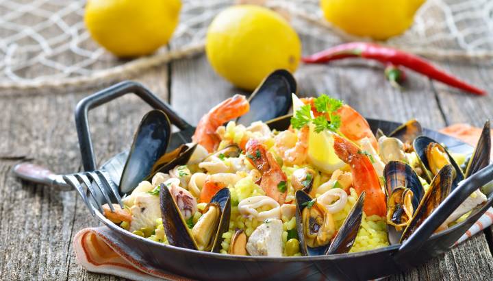 Tasty Spanish paella with seafood and chicken breast
