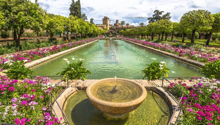 The popular gardens with fountains of Alcazar de los Reyes Cristianos, a medieval building and popular tourist attraction, located in the Andalusian city of Cordoba, Spain