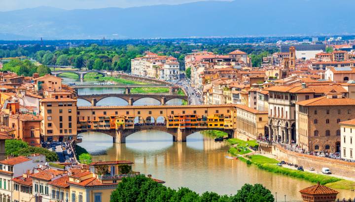 View of medieval stone bridge Ponte Vecchio over Arno river in Florence, Tuscany, Italy. Florence cityscape. Florence architecture and landmark.