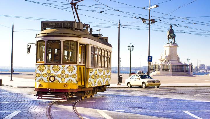 Vintage yellow tramway at the Commerce Square in Lisbon, Portugal