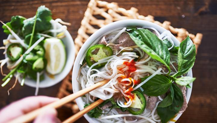 vietnamese pho with spicy sriracha sauce shot top down