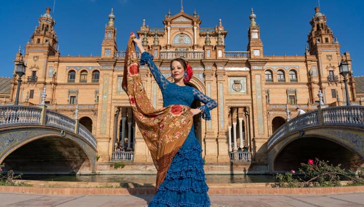 Typical Spanish woman dancing flamenco in Seville, Andalusia, Spain.-min