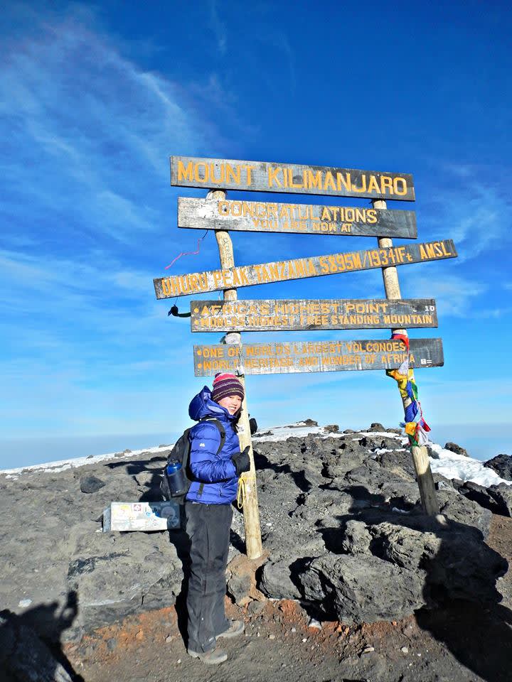 Tailoremade expert Thidara on the summit of Kilimanjaro
