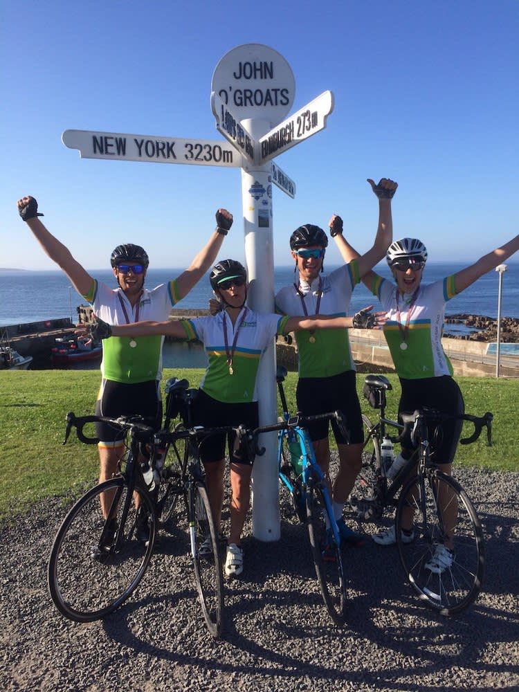 Our LEJOG team celebrating at their final destination - John O'Groats