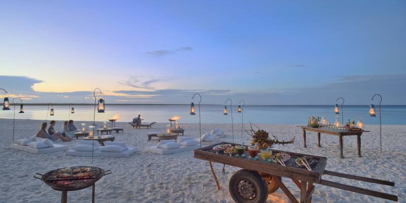 Romantic dinner at the beach at hotel Mnemba Island Lodge, Zanzibar, Tanzania - Perfect for Winter travel